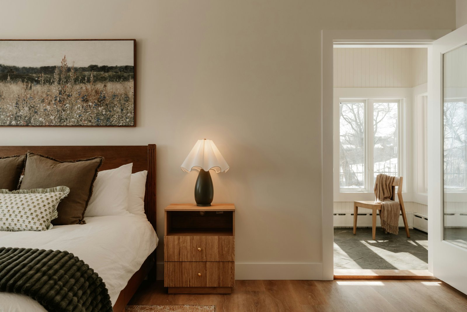 Comparison between blue-toned office lighting and warm amber living room lighting at night.