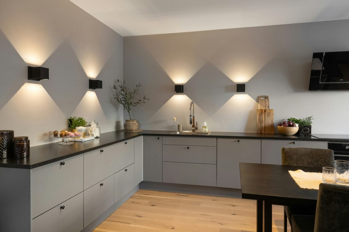 Modern kitchen with warm smart under-cabinet lighting creating a cozy nighttime atmosphere