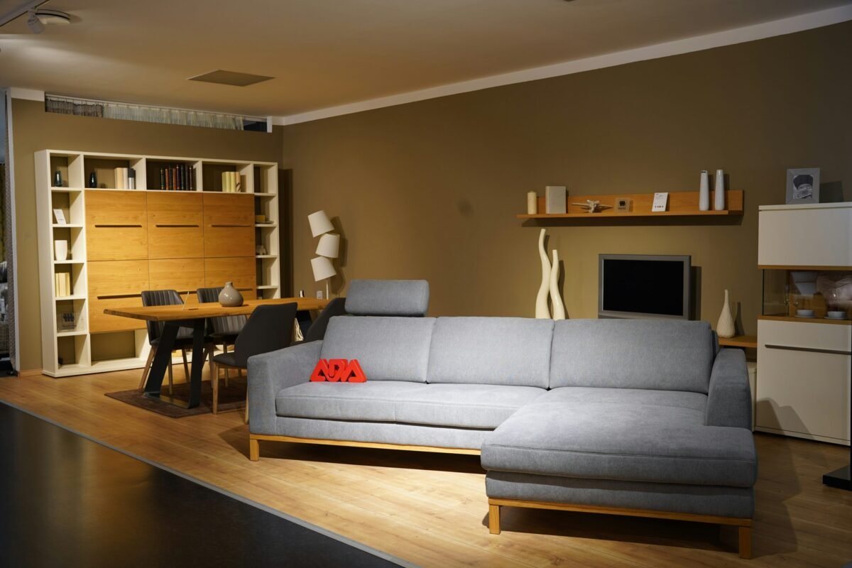 Comfortable modern living room with warm ambient lighting, cozy sofa, and smart speaker on coffee table